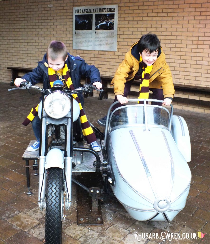 Kids playing on Hagrid's flying motorbike at the Harry Potter studio tour