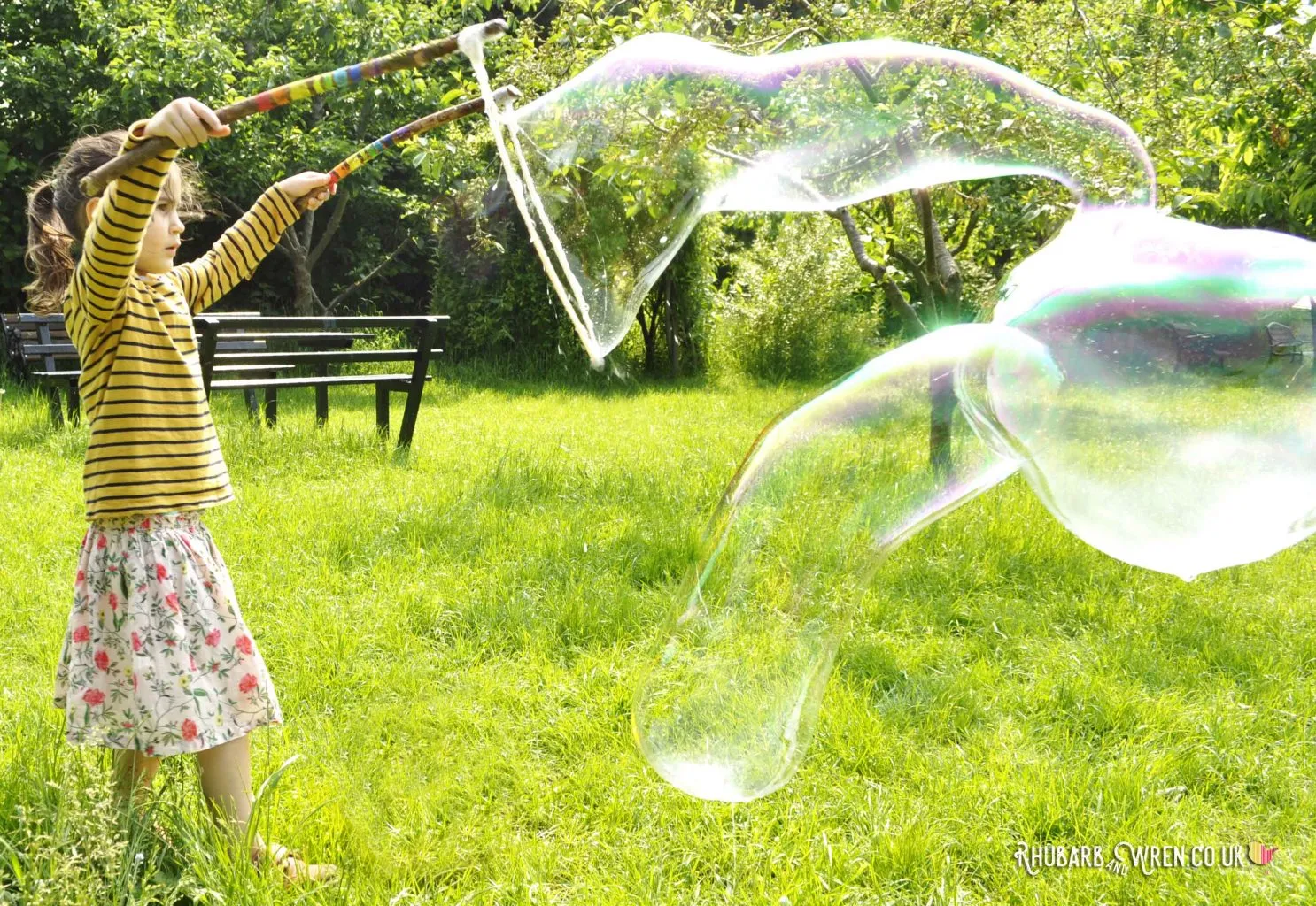 Giant bubbles made with diy bubble mix recipe and wands