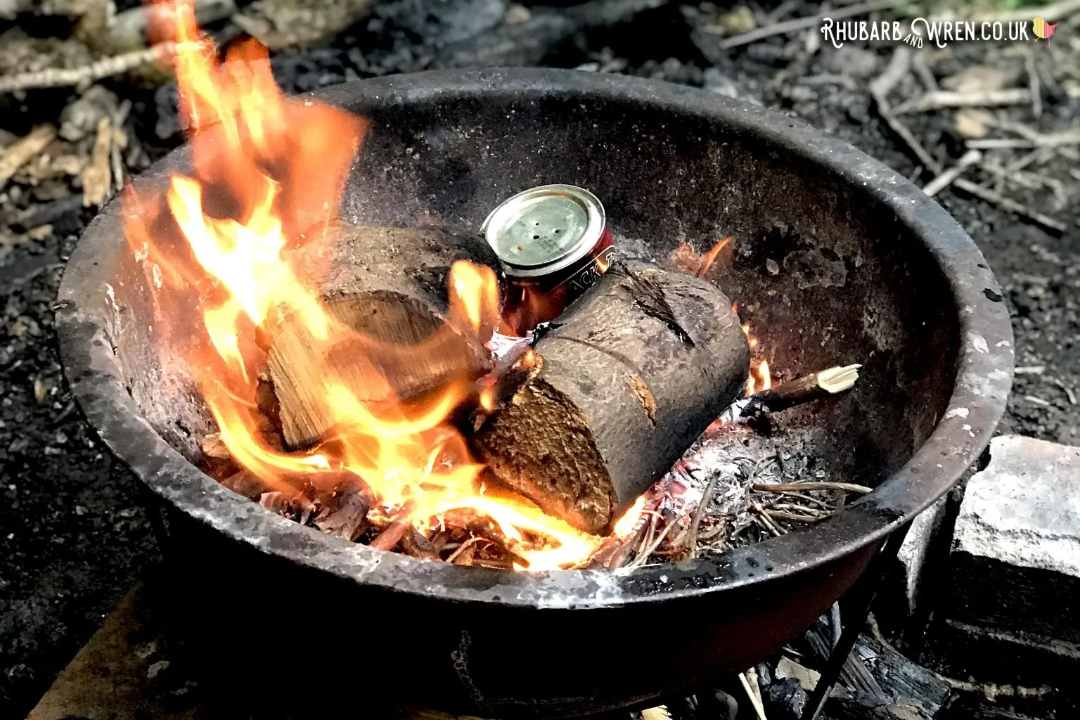 https://rhubarbandwren.co.uk/wp-content/uploads/2022/03/charcoal-making-tin-on-campfire-1536x1024.jpg